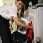 student washing clothes